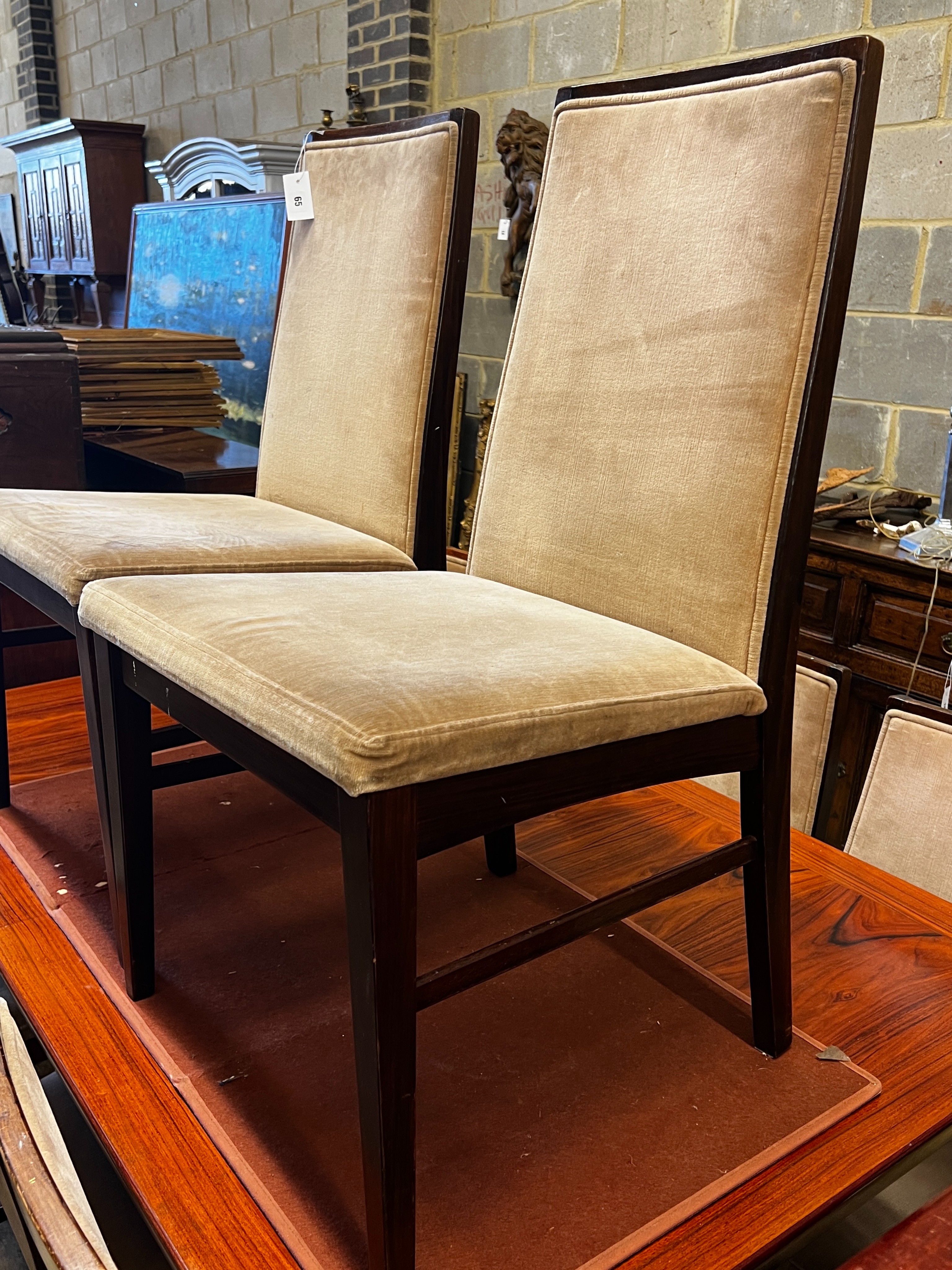 A mid century design hardwood extending dining table, length 265cm extended, two spare leaves, depth 99cm, height 72cm and eight chairs